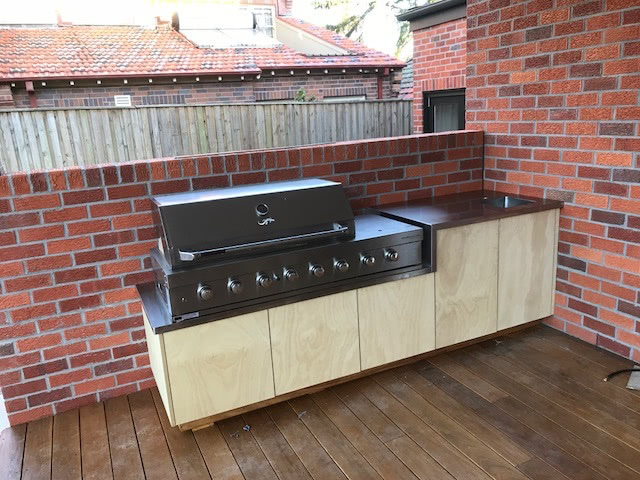 BBQ cabinet near the wall