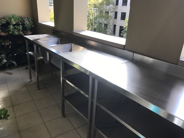 stainless steel work bench near the window