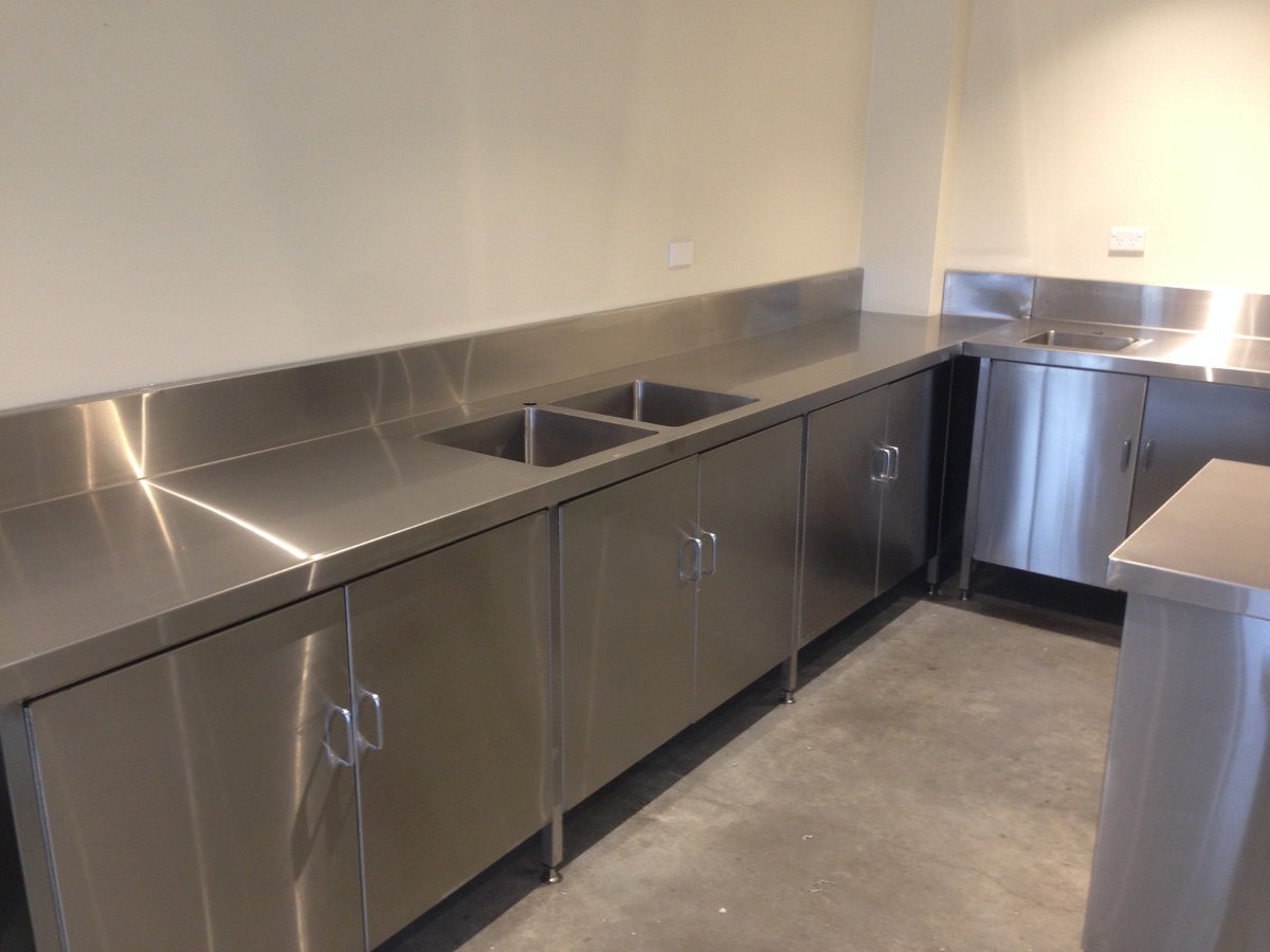 freshly installed stainless steel bench with sinks