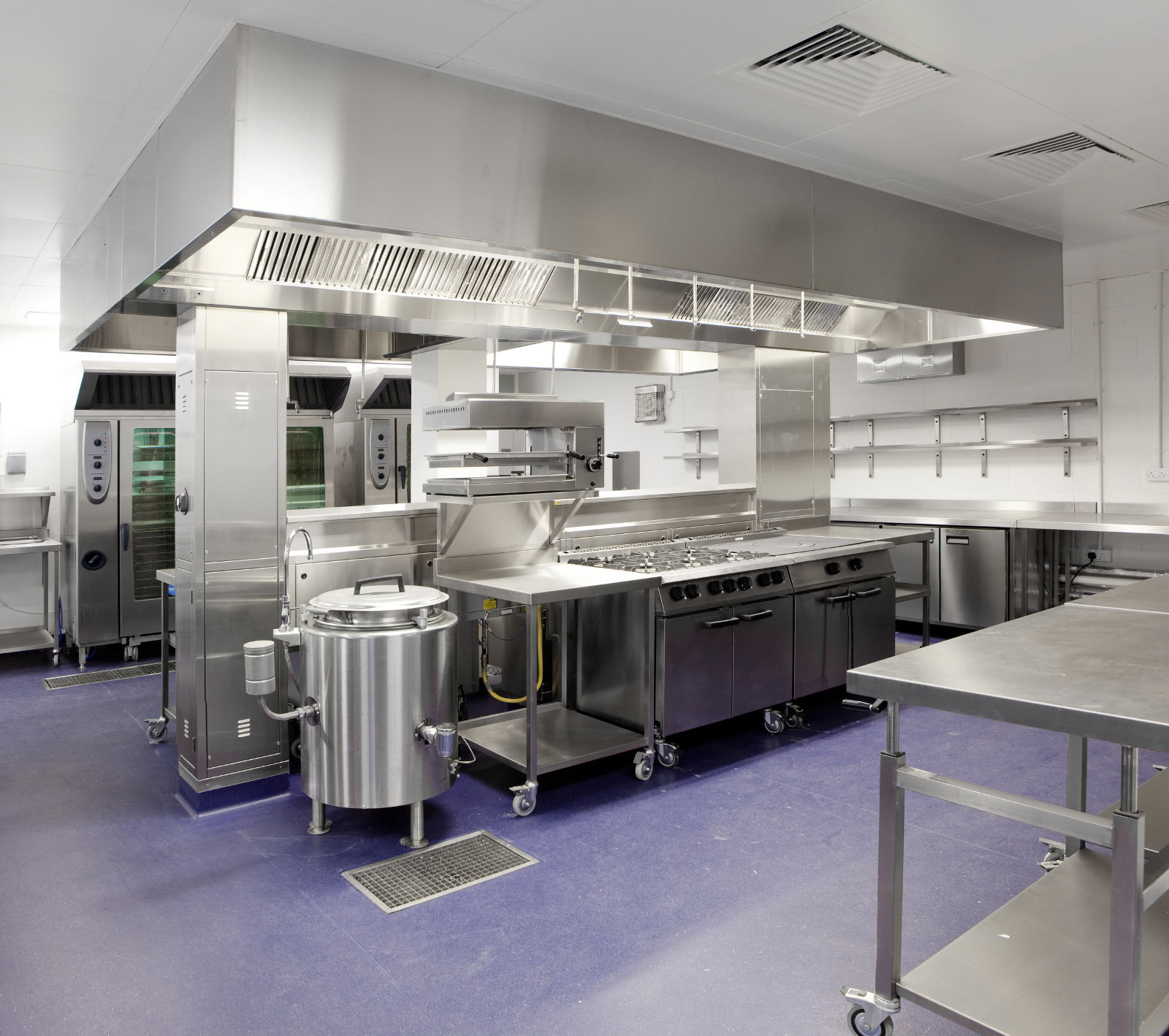 stainless steel commercial kitchen with hood